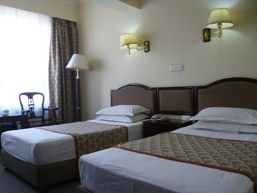 Gan Jin Hotel Tientsin Oda fotoğraf